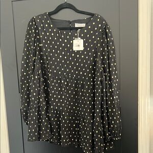 Black long sleeve relaxed blouse with crew neck and boxy style